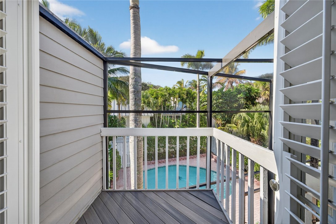 2525 Ocean Drive, Unit 3 Vero Beach, FL 32963 - Photo 14 of 36 a view of a small deck with wooden floor and fence