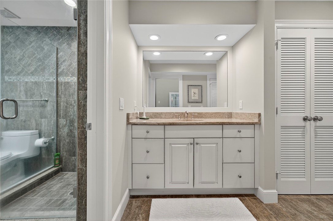 2525 Ocean Drive, Unit 3 Vero Beach, FL 32963 - Photo 15 of 36 a bathroom with a sink a toilet and shower