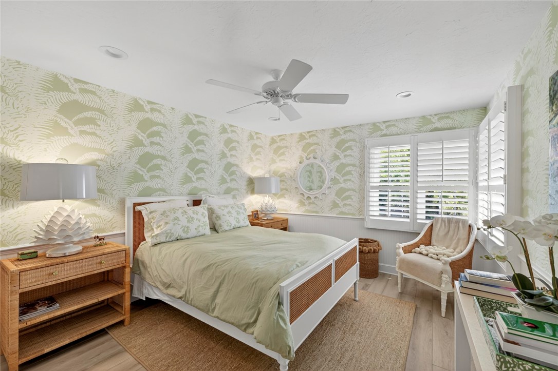 2525 Ocean Drive, Unit 3 Vero Beach, FL 32963 - Photo 18 of 36 a bedroom with a bed and a lounge chair