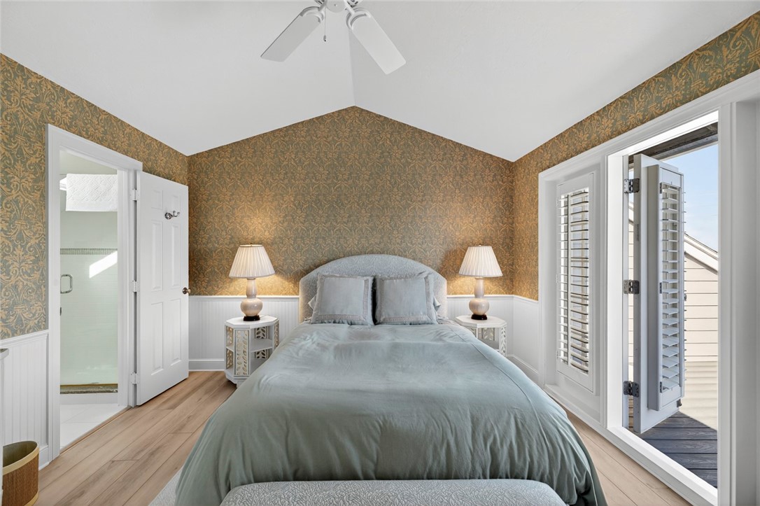 2525 Ocean Drive, Unit 3 Vero Beach, FL 32963 - Photo 23 of 36 a bedroom with a bed and a large mirror