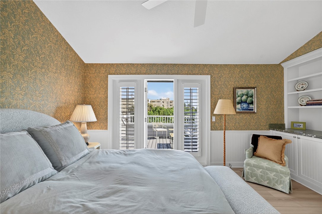 2525 Ocean Drive, Unit 3 Vero Beach, FL 32963 - Photo 24 of 36 a bedroom with a large bed and a couch