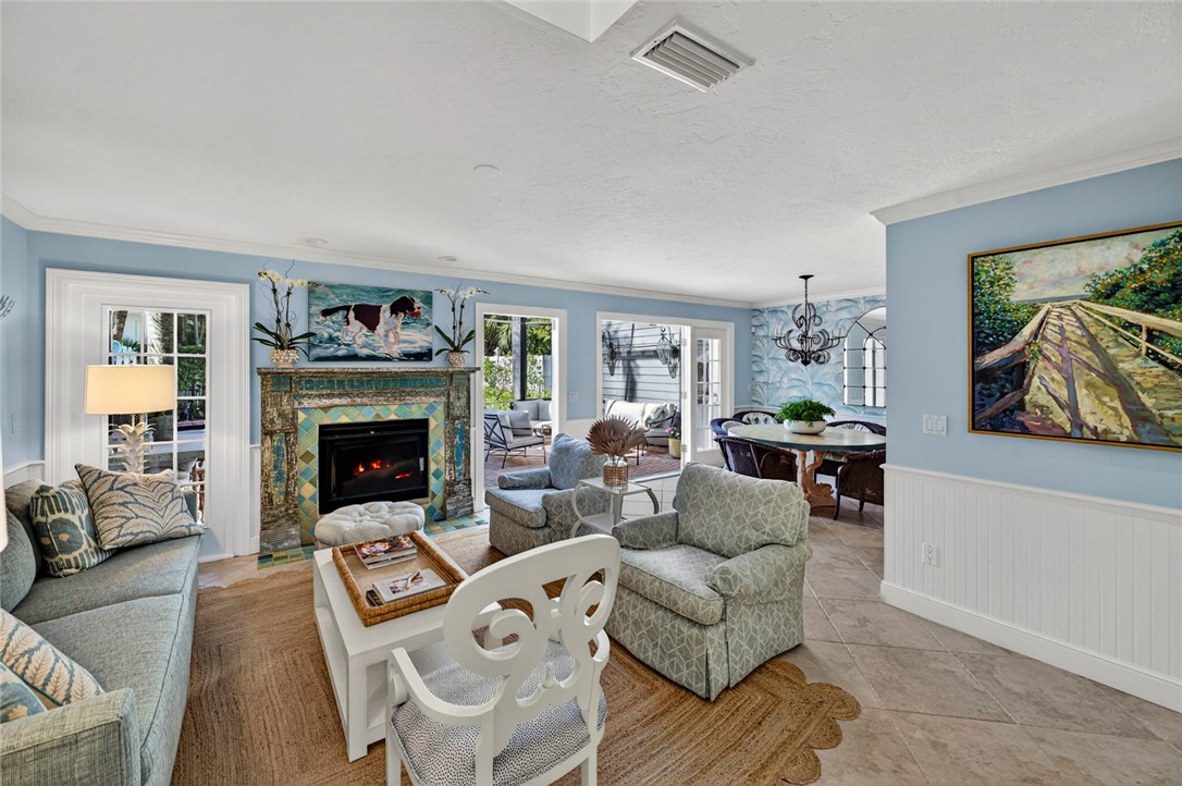 2525 Ocean Drive, Unit 3 Vero Beach, FL 32963 - Photo 3 of 36 a living room with furniture and a fireplace