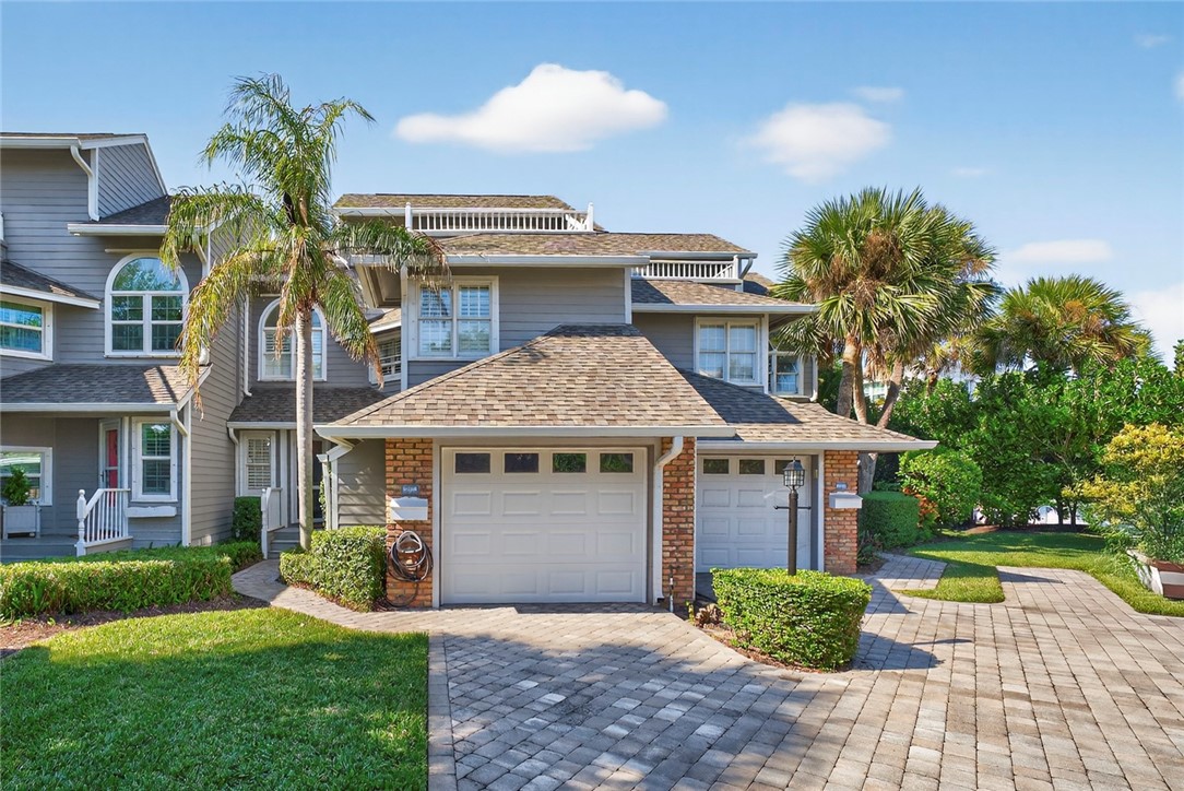 2525 Ocean Drive, Unit 3 Vero Beach, FL 32963 - Photo 34 of 36 a front view of a house with garden