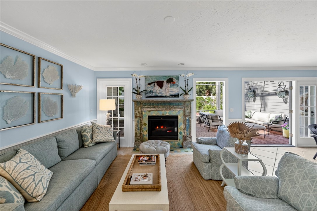 2525 Ocean Drive, Unit 3 Vero Beach, FL 32963 - Photo 4 of 36 a living room with furniture and a fireplace
