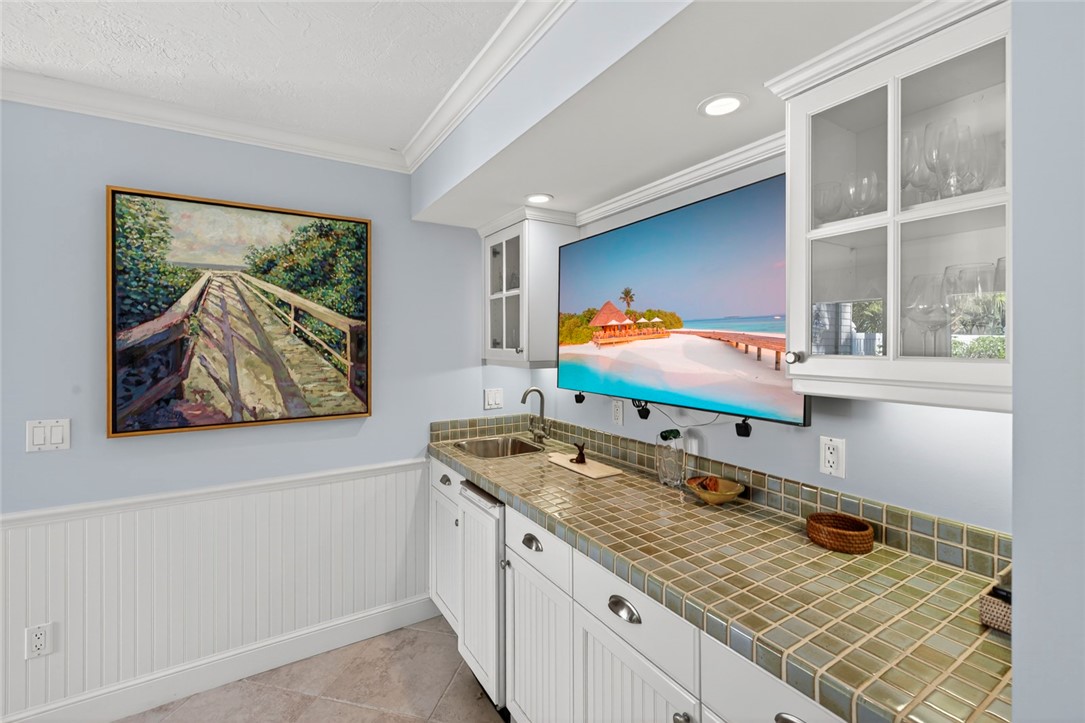 2525 Ocean Drive, Unit 3 Vero Beach, FL 32963 - Photo 6 of 36 a bathroom with a granite countertop sink and a window