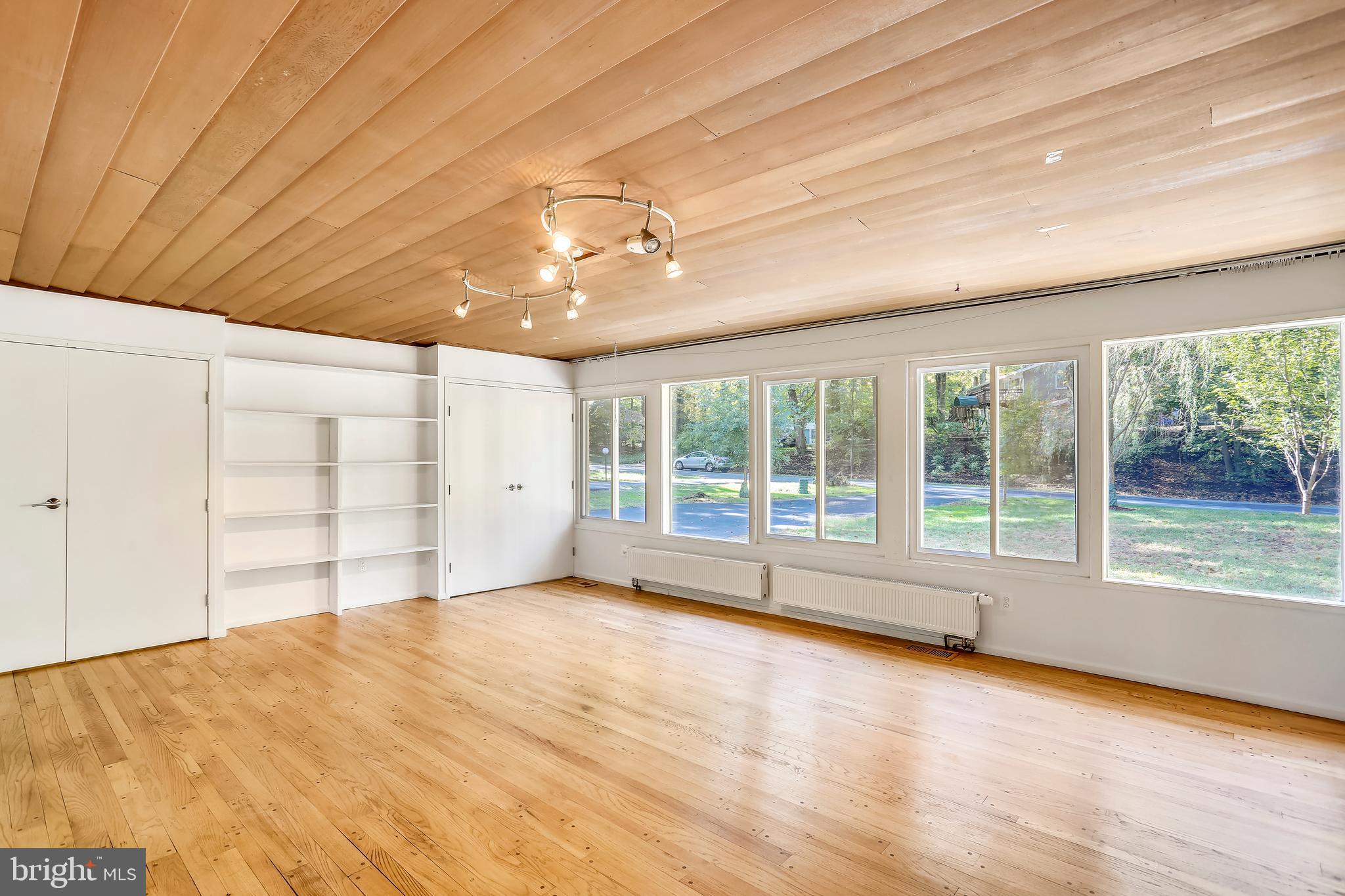 7504 Hamilton Spring Road Bethesda, MD 20817 - Photo 13 of 52 Built-ins and wall of glass in FR