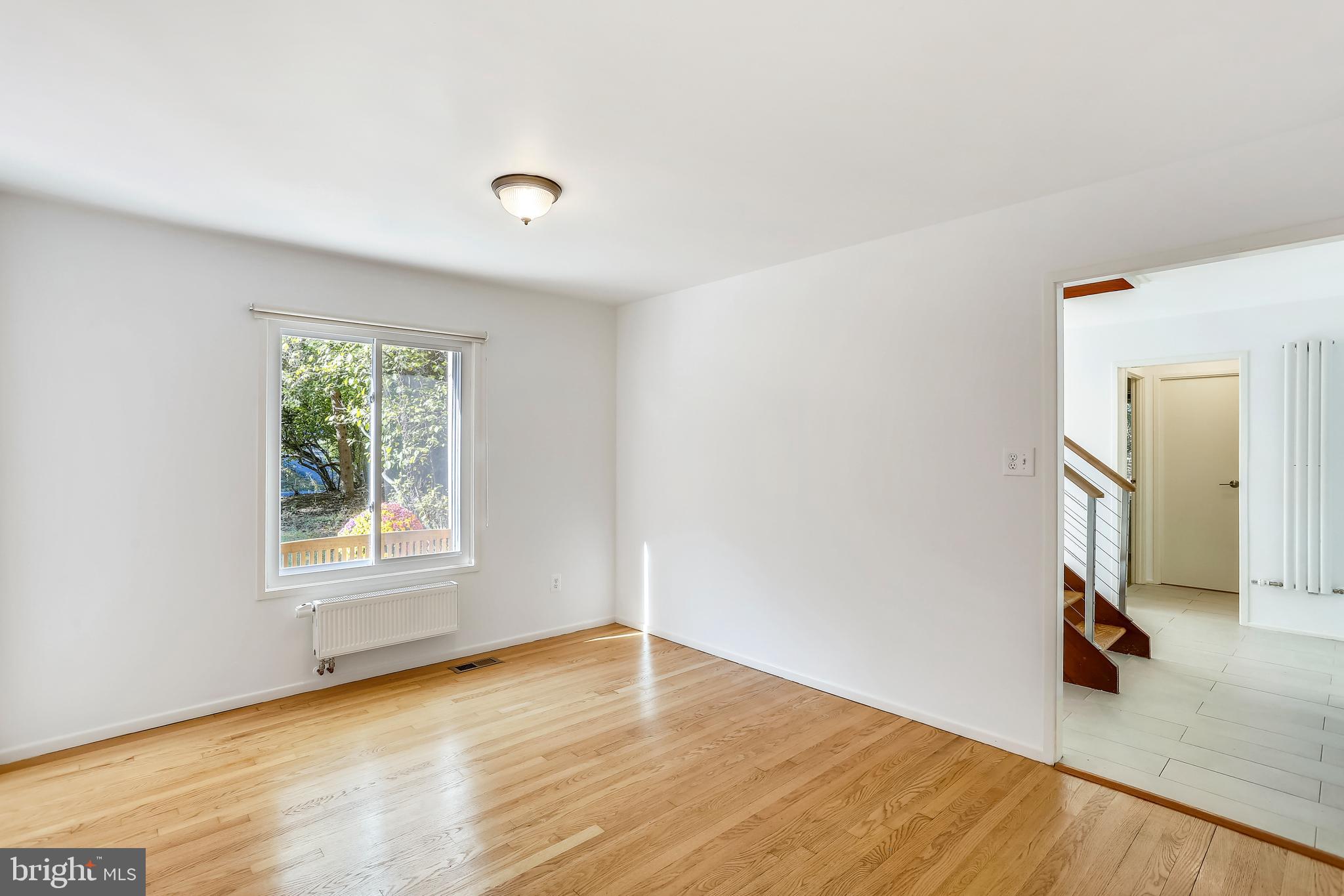 7504 Hamilton Spring Road Bethesda, MD 20817 - Photo 16 of 52 Dining room to foyer and window overlooking front