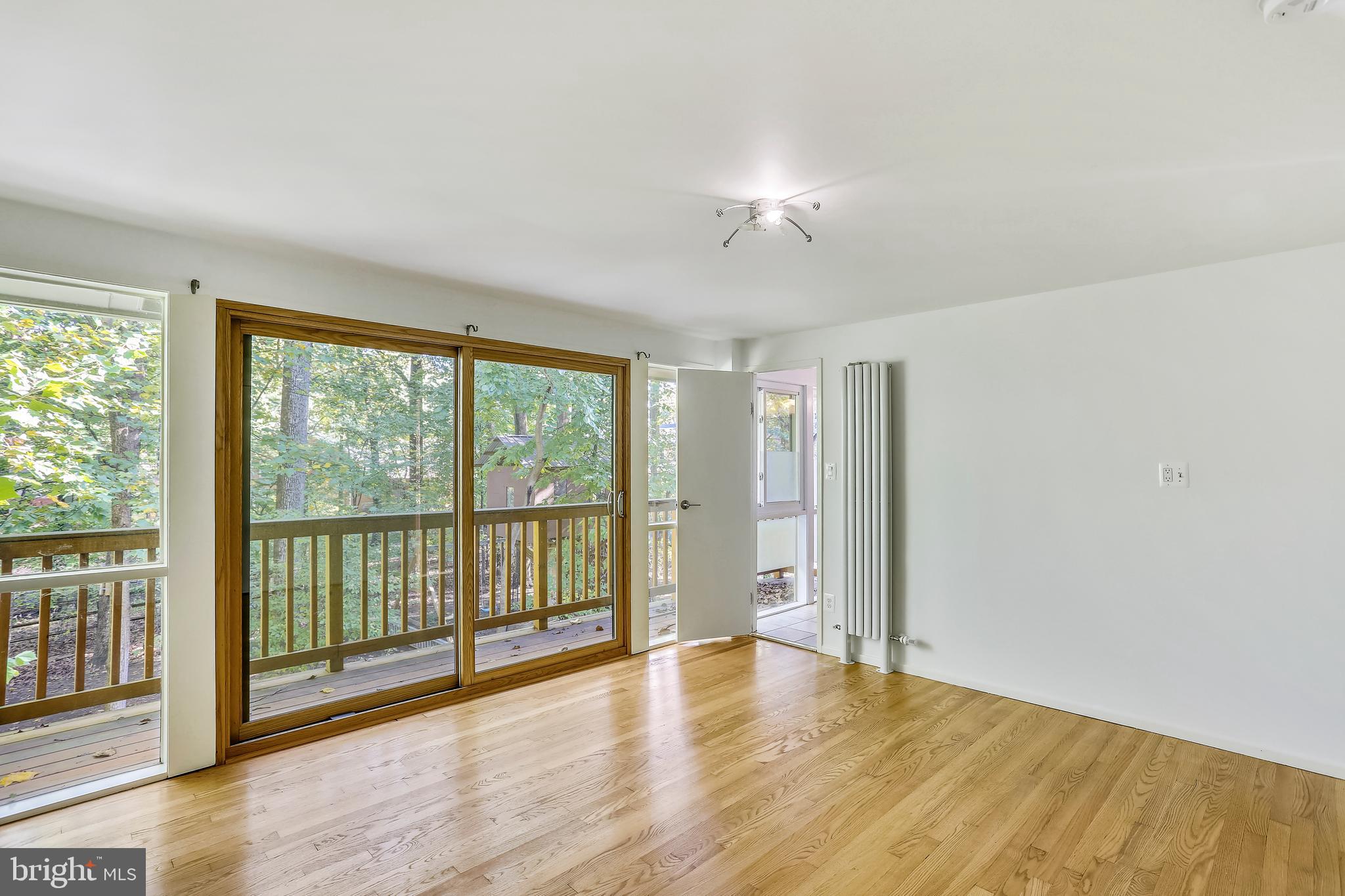 7504 Hamilton Spring Road Bethesda, MD 20817 - Photo 23 of 52 Master bedroom with balcony overlooking back