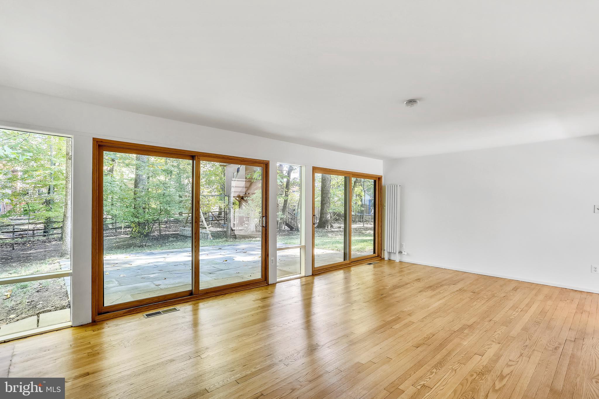 7504 Hamilton Spring Road Bethesda, MD 20817 - Photo 4 of 52 Wall of windows in living room