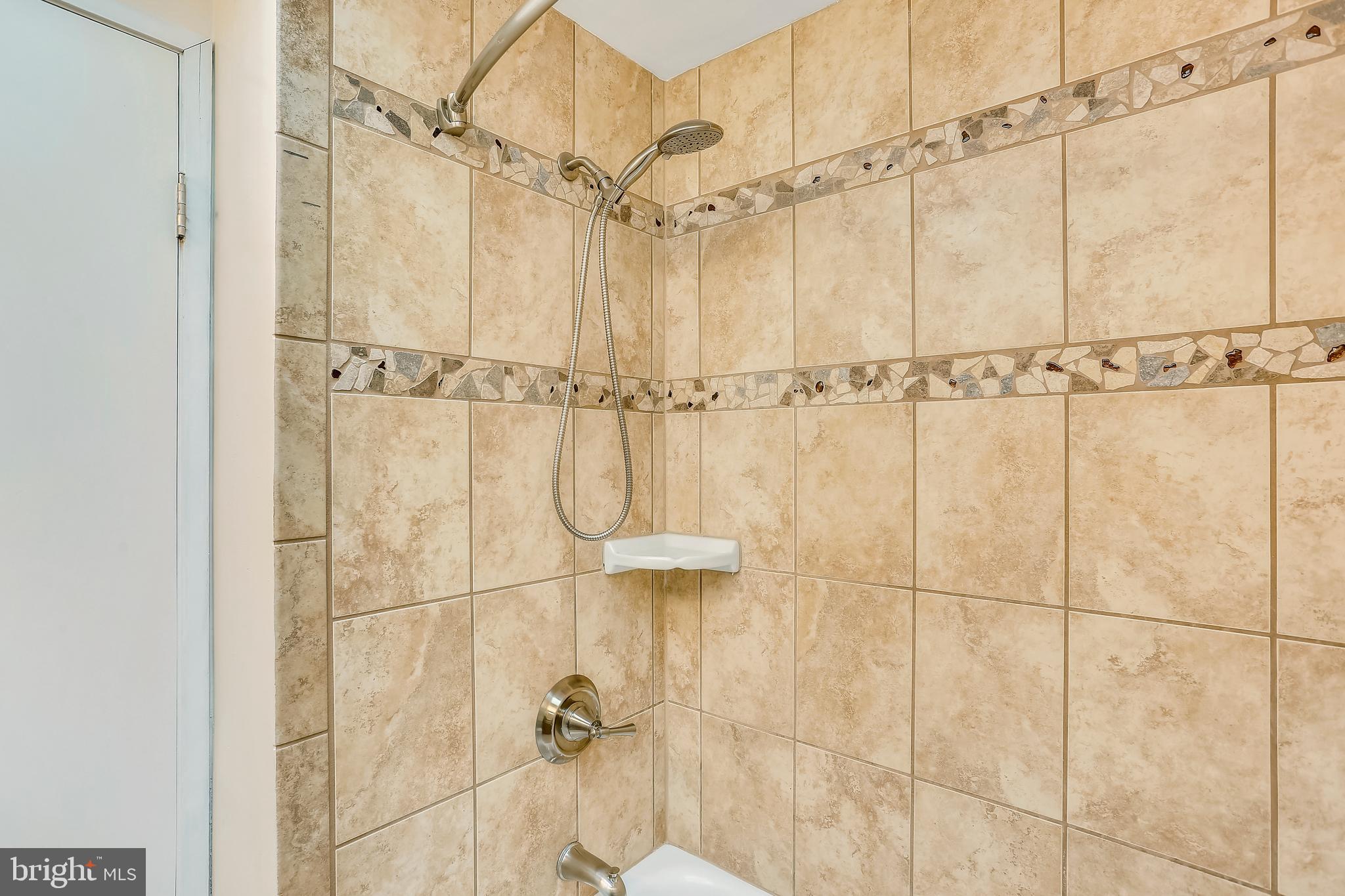7504 Hamilton Spring Road Bethesda, MD 20817 - Photo 36 of 52 Beautiful shower with tub in renovated hall bath