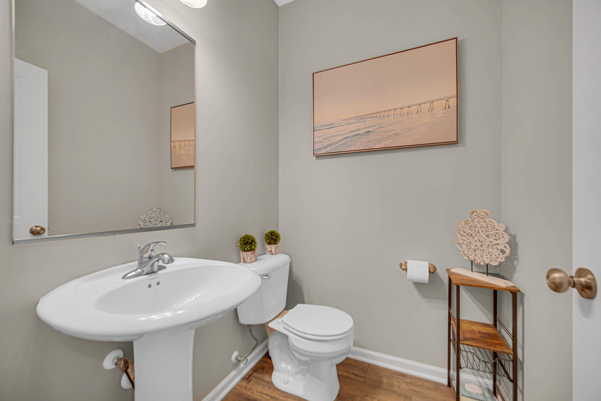 1023 East 117th Lane Crown Point, IN 46307 - Photo 11 of 22 a bathroom with a toilet a sink and mirror