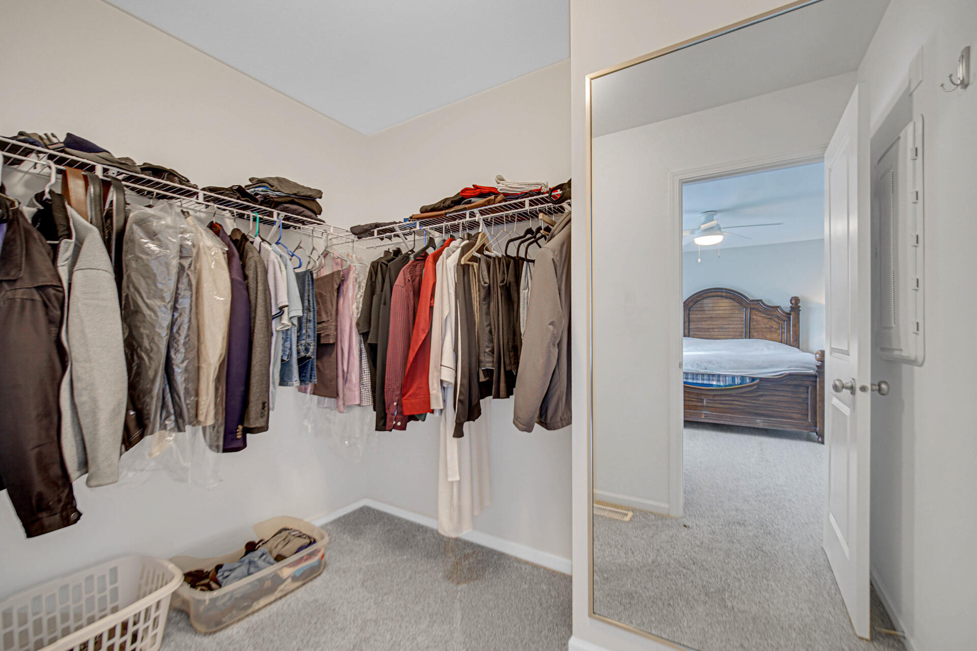 1023 East 117th Lane Crown Point, IN 46307 - Photo 16 of 22 a view of walk in closet with clothes and shoes