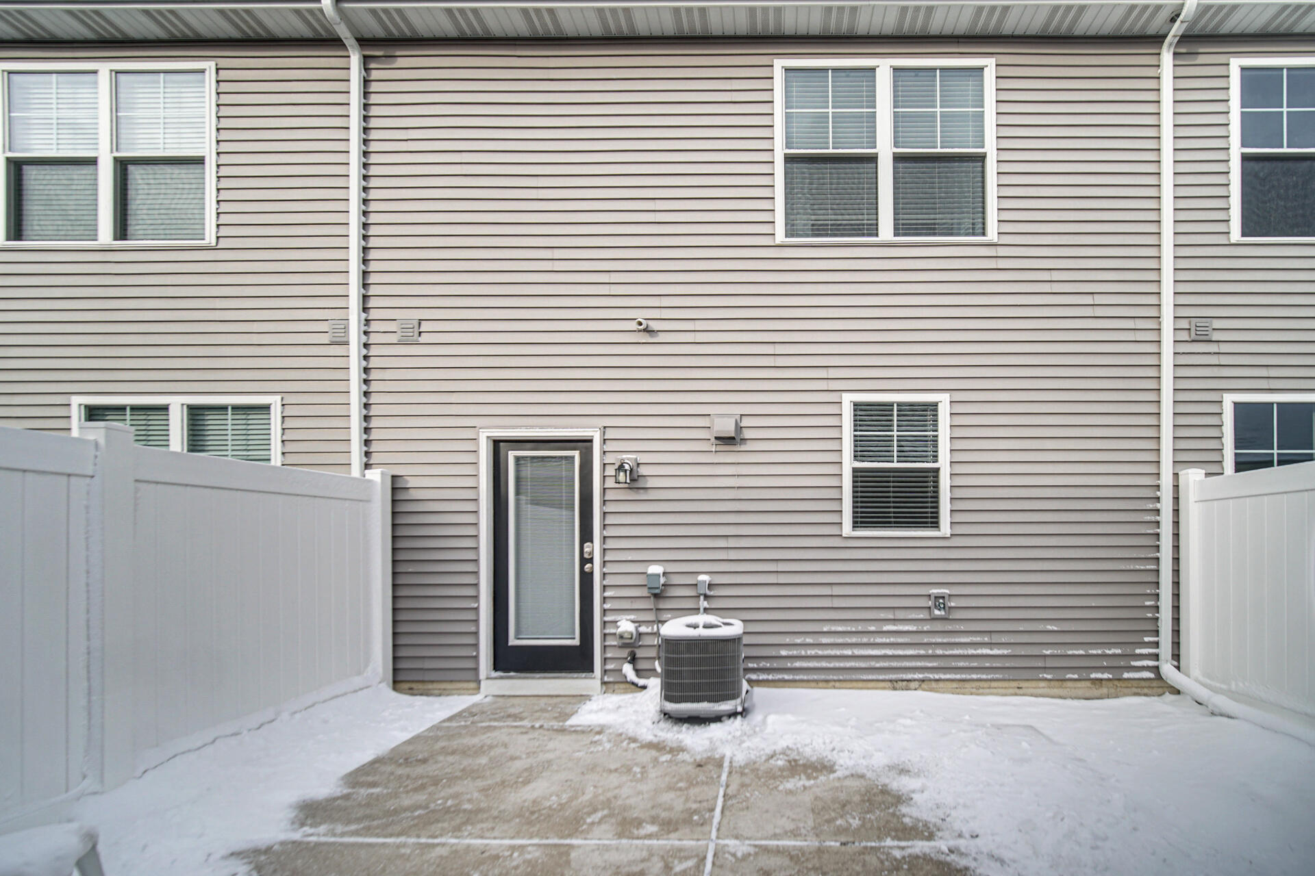 1023 East 117th Lane Crown Point, IN 46307 - Photo 20 of 22 a side view of a house with white door