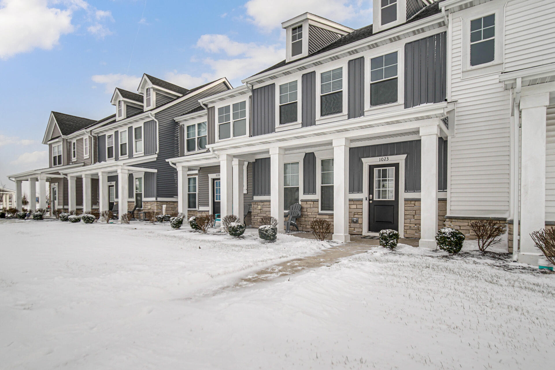 1023 East 117th Lane Crown Point, IN 46307 - Photo 3 of 22 a front view of a building with cars parked