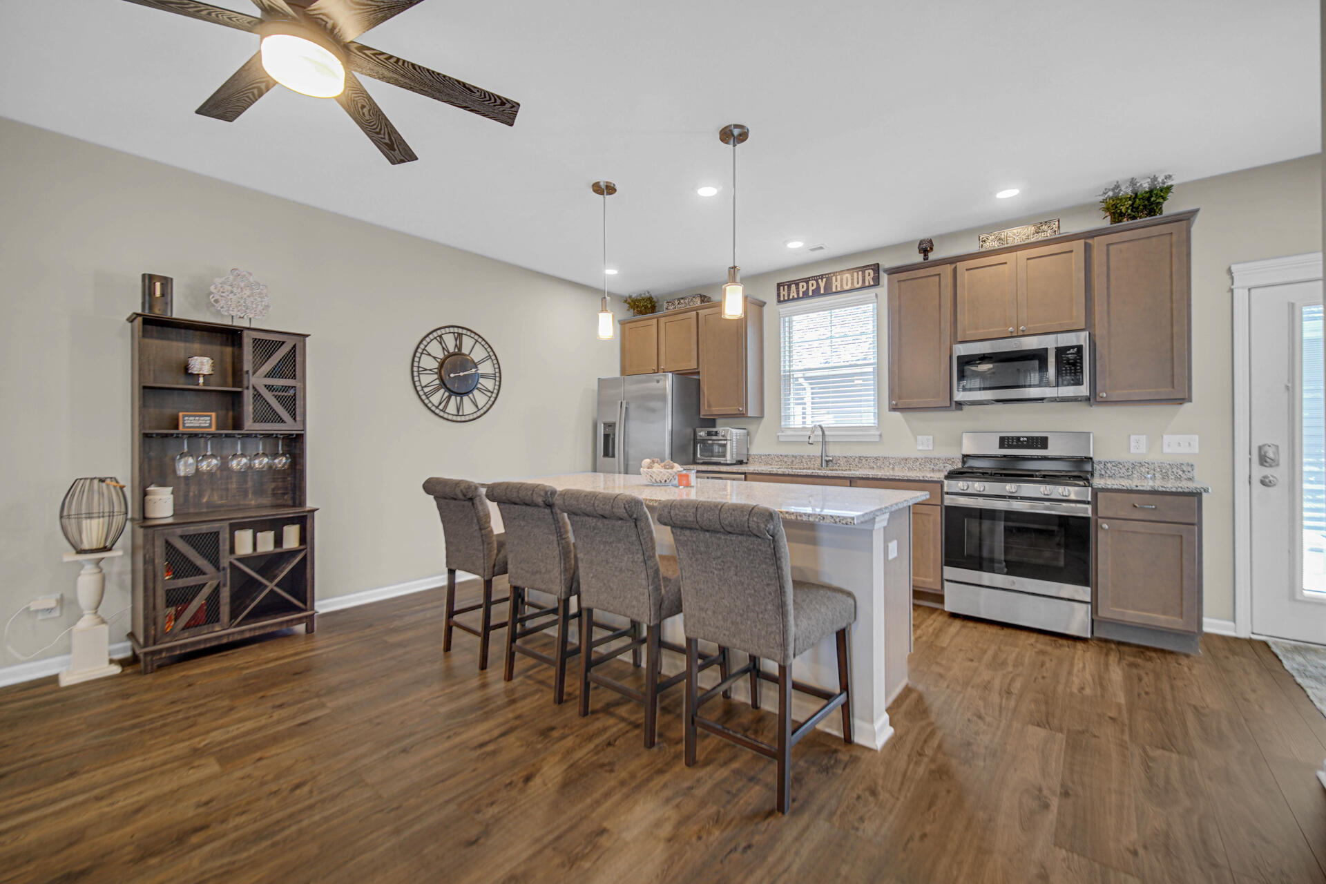 1023 East 117th Lane Crown Point, IN 46307 - Photo 9 of 22 a kitchen with stainless steel appliances a stove a microwave a sink a stove and a refrigerator