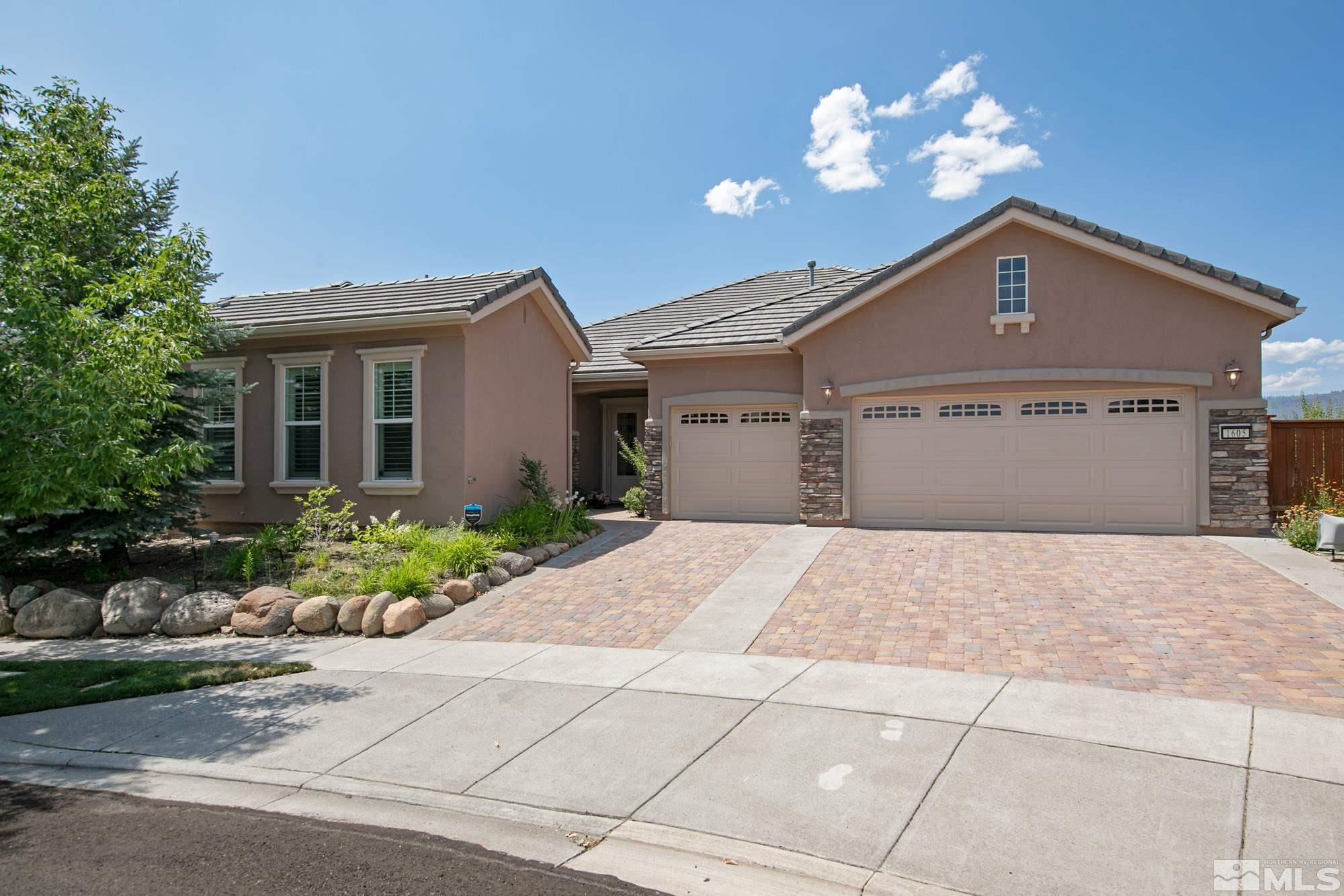 1605 Ashland Bluff Way Reno, NV 89523 - Photo 1 of 37 a front view of a house with a yard and a garage