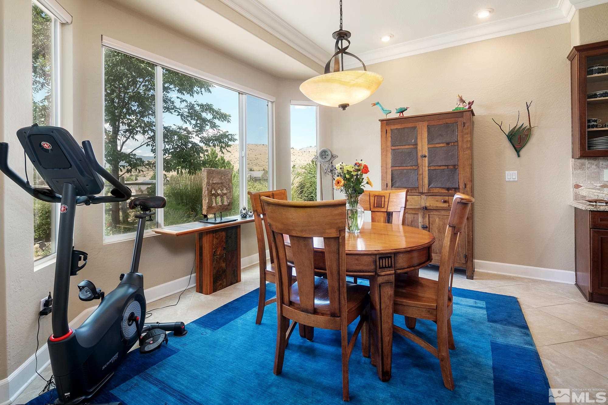 1605 Ashland Bluff Way Reno, NV 89523 - Photo 12 of 37 a view of a dining room with furniture window and wooden floor