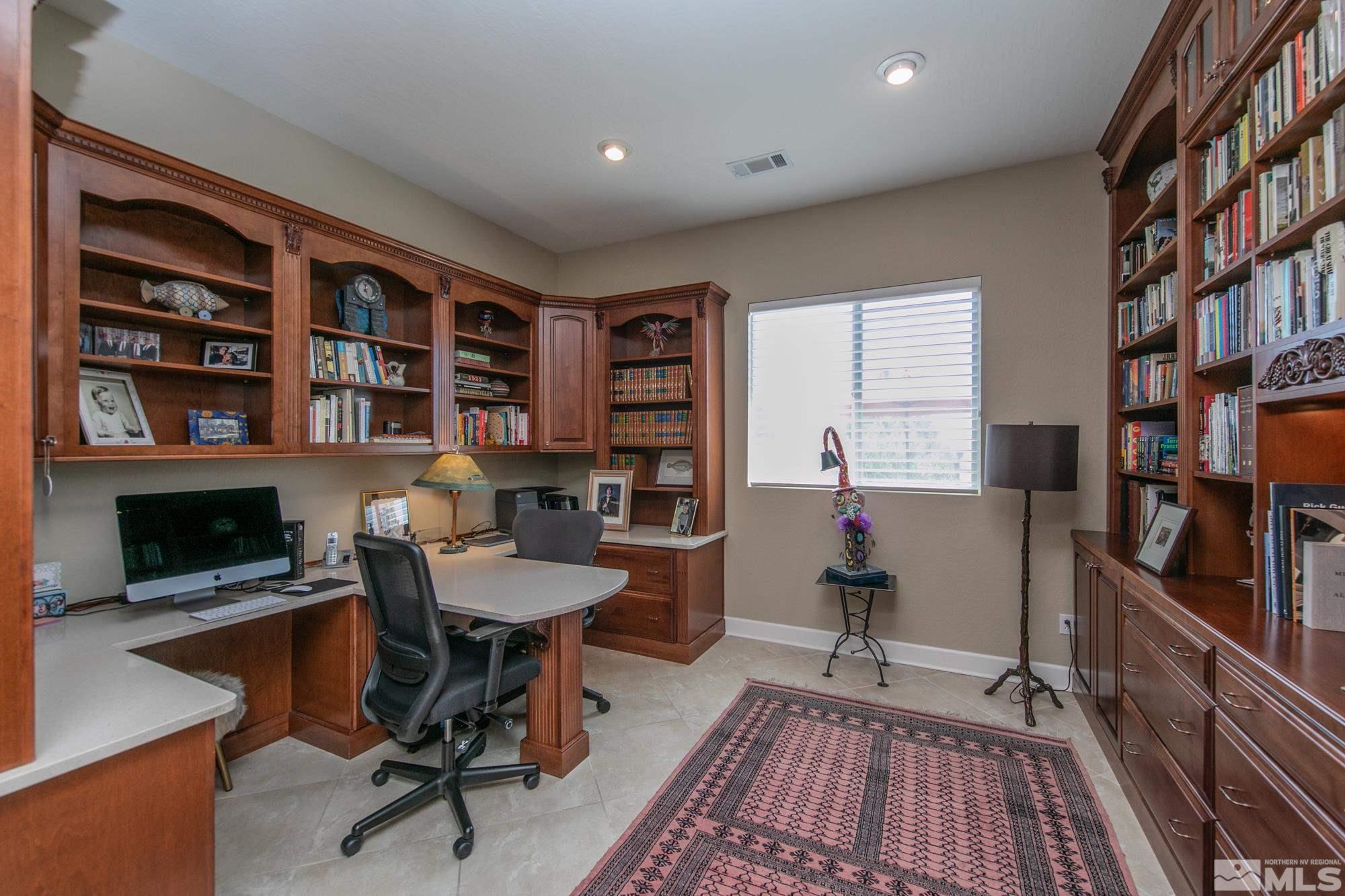 1605 Ashland Bluff Way Reno, NV 89523 - Photo 17 of 37 a view of a workspace with furniture and a bookshelf