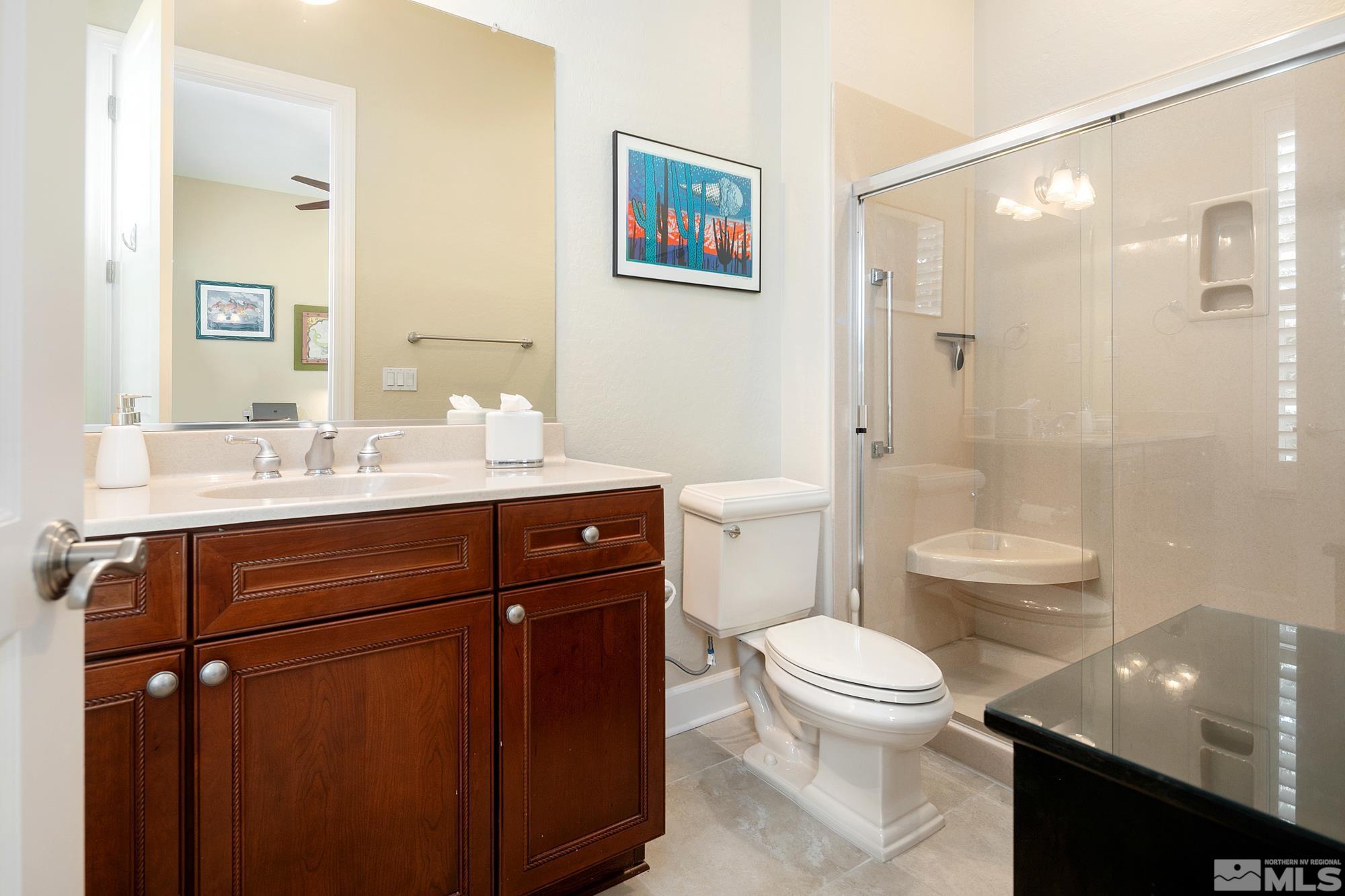 1605 Ashland Bluff Way Reno, NV 89523 - Photo 18 of 37 a bathroom with a sink a toilet and shower