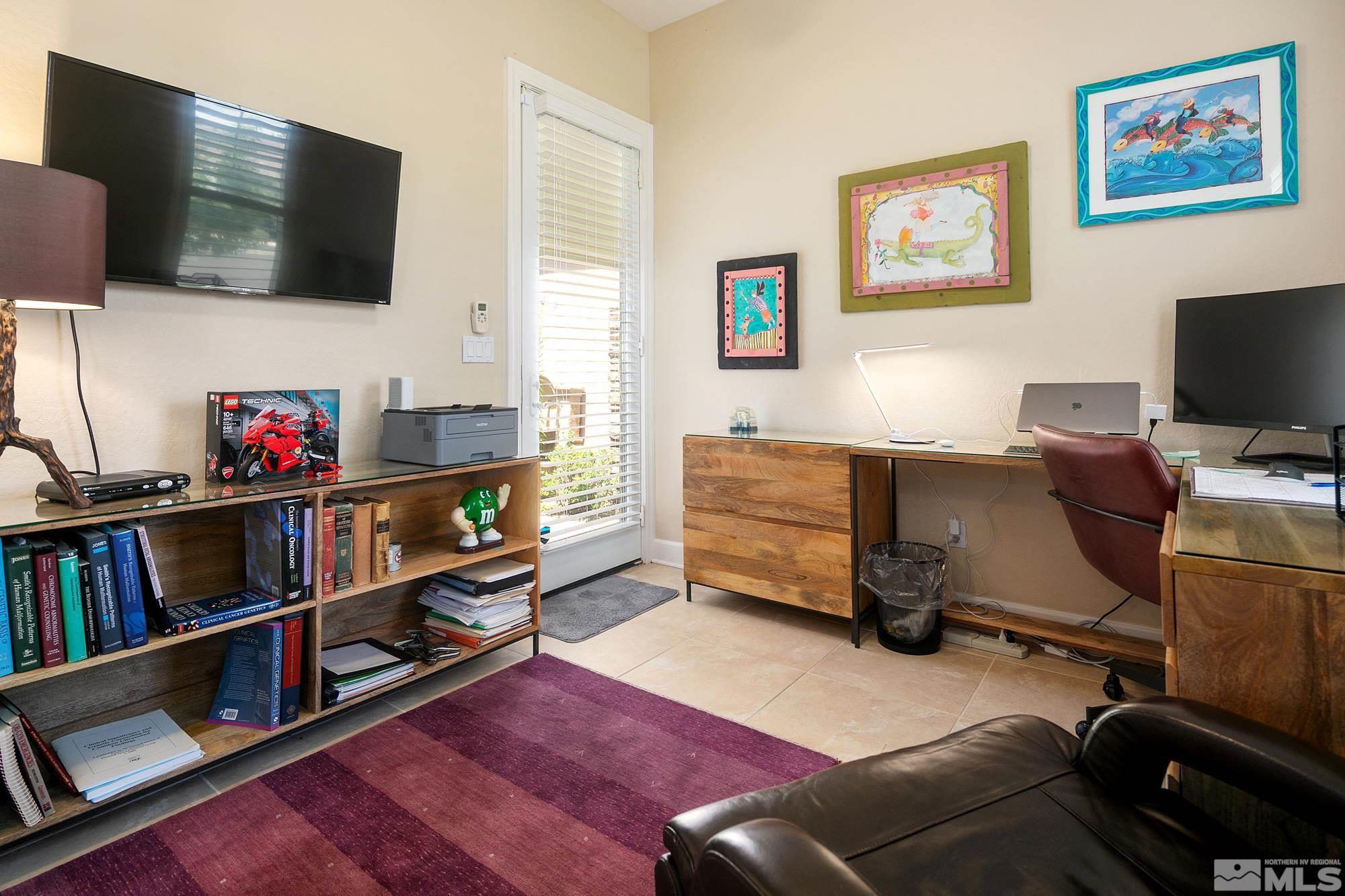 1605 Ashland Bluff Way Reno, NV 89523 - Photo 20 of 37 a livingroom with lounge chair and a flat screen tv