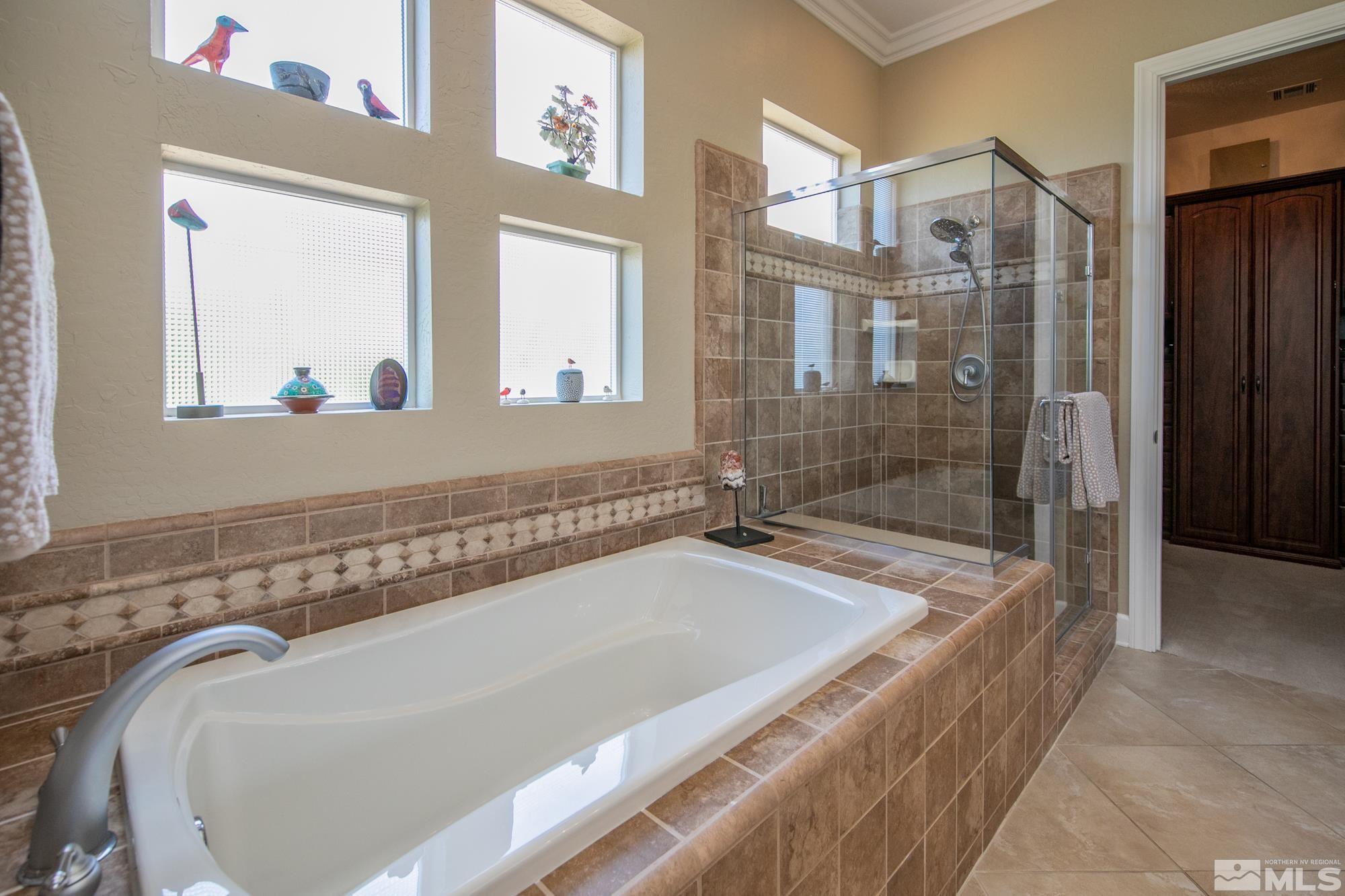 1605 Ashland Bluff Way Reno, NV 89523 - Photo 24 of 37 a bathroom with a bathtub and shower