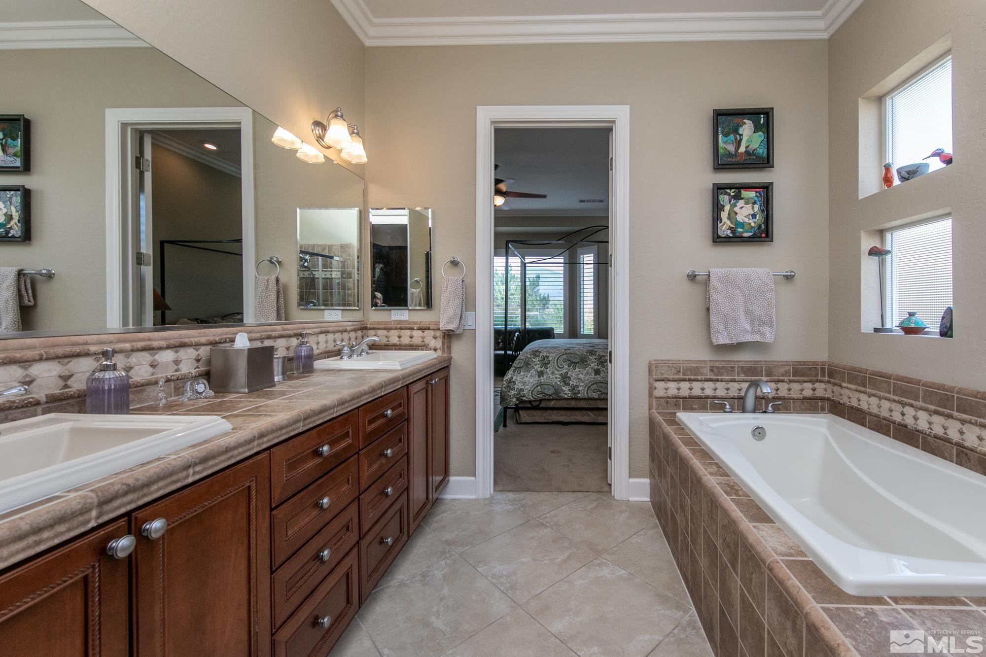 1605 Ashland Bluff Way Reno, NV 89523 - Photo 25 of 37 a spacious bathroom with a tub sink and mirror