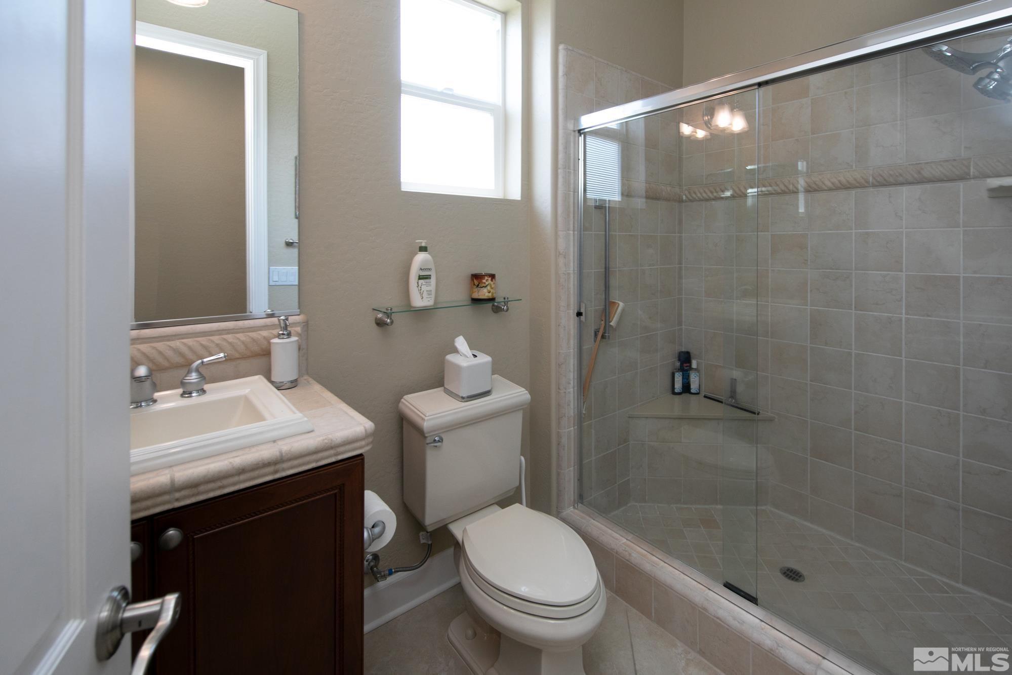 1605 Ashland Bluff Way Reno, NV 89523 - Photo 27 of 37 a bathroom with a sink toilet and shower