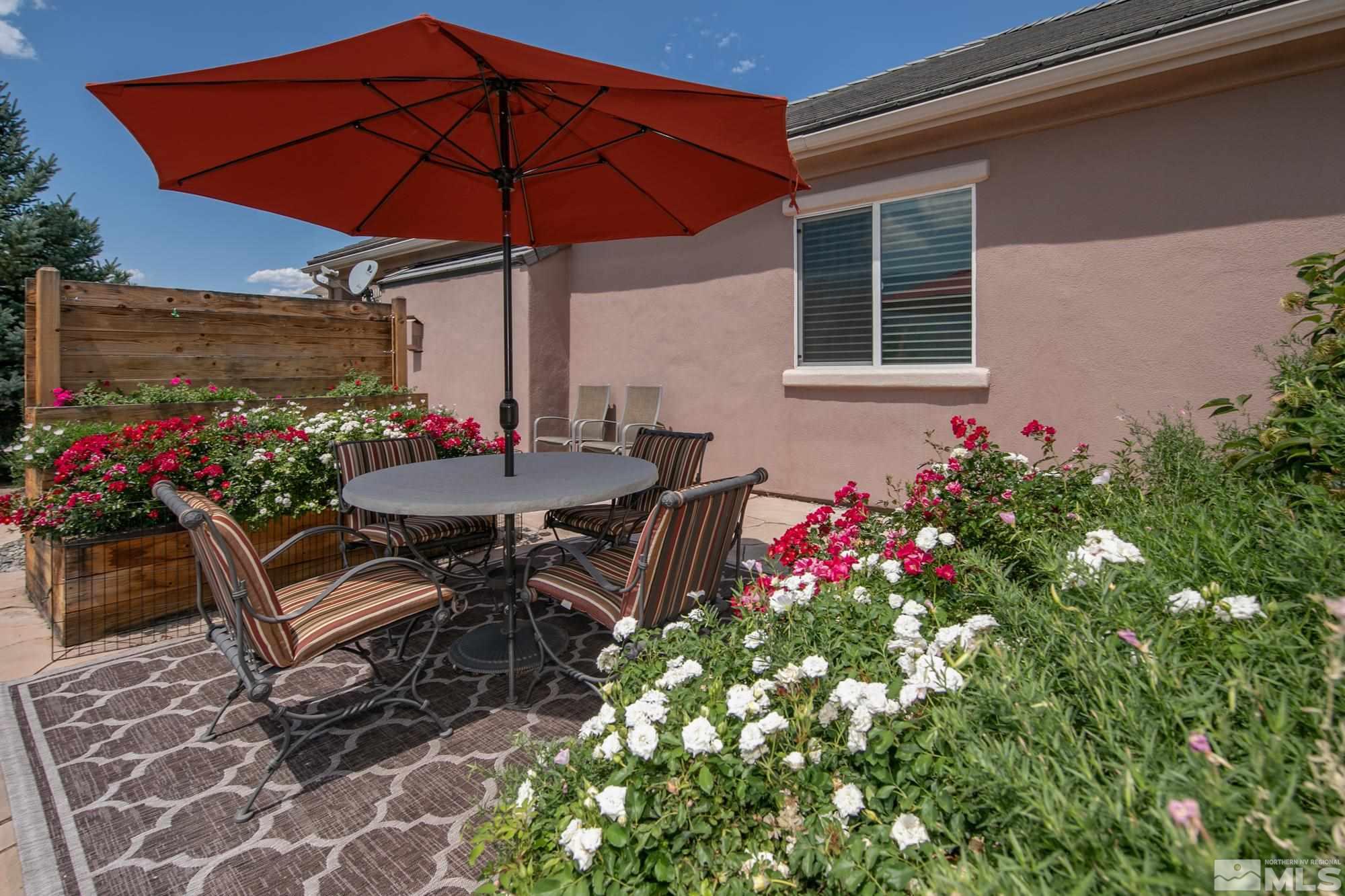 1605 Ashland Bluff Way Reno, NV 89523 - Photo 31 of 37 a view of a tables and chairs under an umbrella