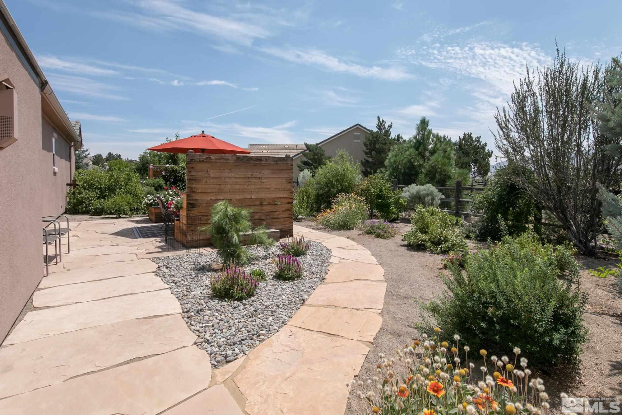 1605 Ashland Bluff Way Reno, NV 89523 - Photo 32 of 37 a view of a patio with furniture and a garden