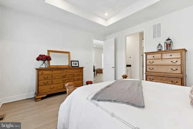 a bedroom with a bed and a dresser