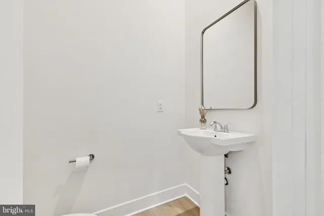 a bathroom with a sink and mirror