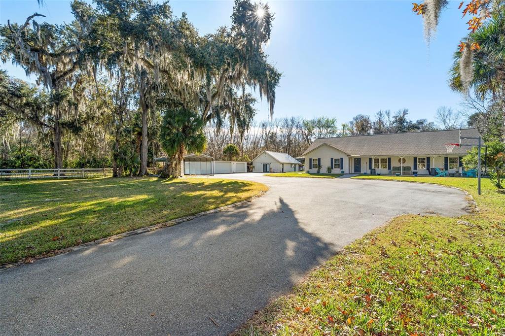 3080 Ragis Road Edgewater, FL 32132 - Photo 13 of 86 a view of swimming pool with outdoor seating and lake view