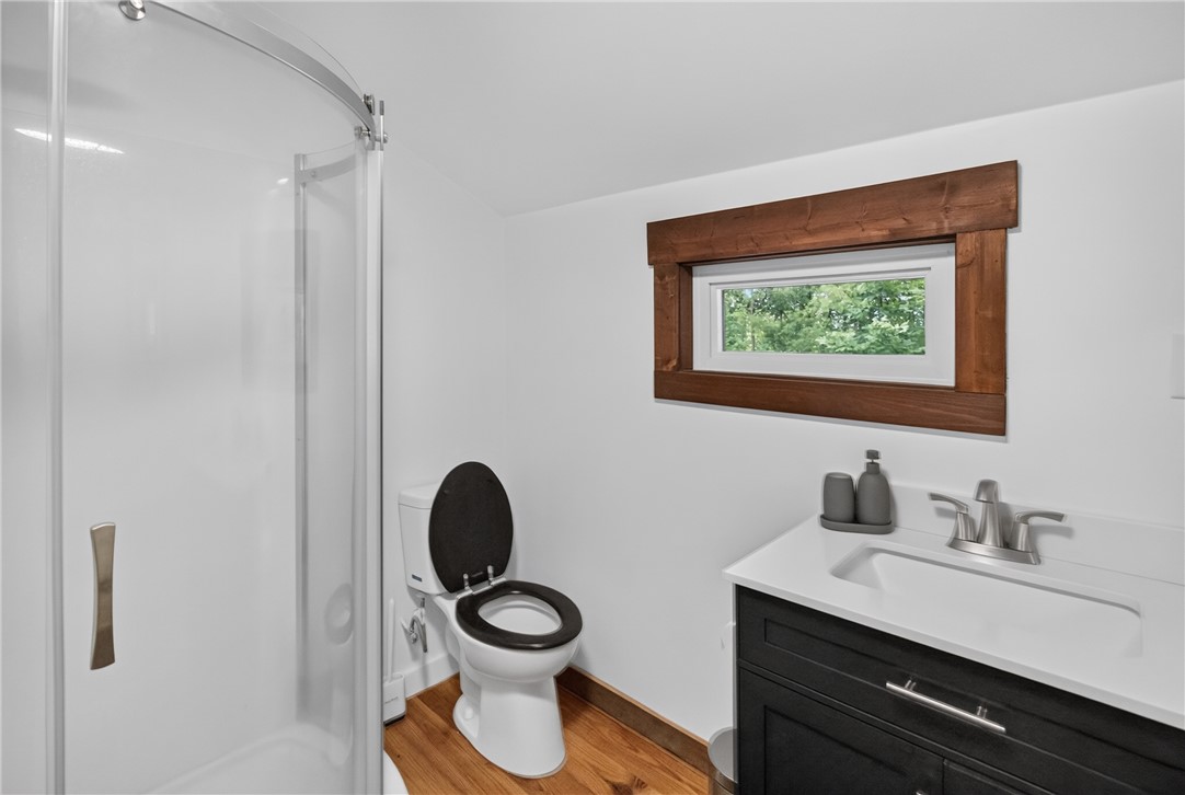 130 Maggie Rufus Lane Westminster, SC 29693 - Photo 20 of 50 A well-appointed bathroom features a bright window and a functional shower enclosure.