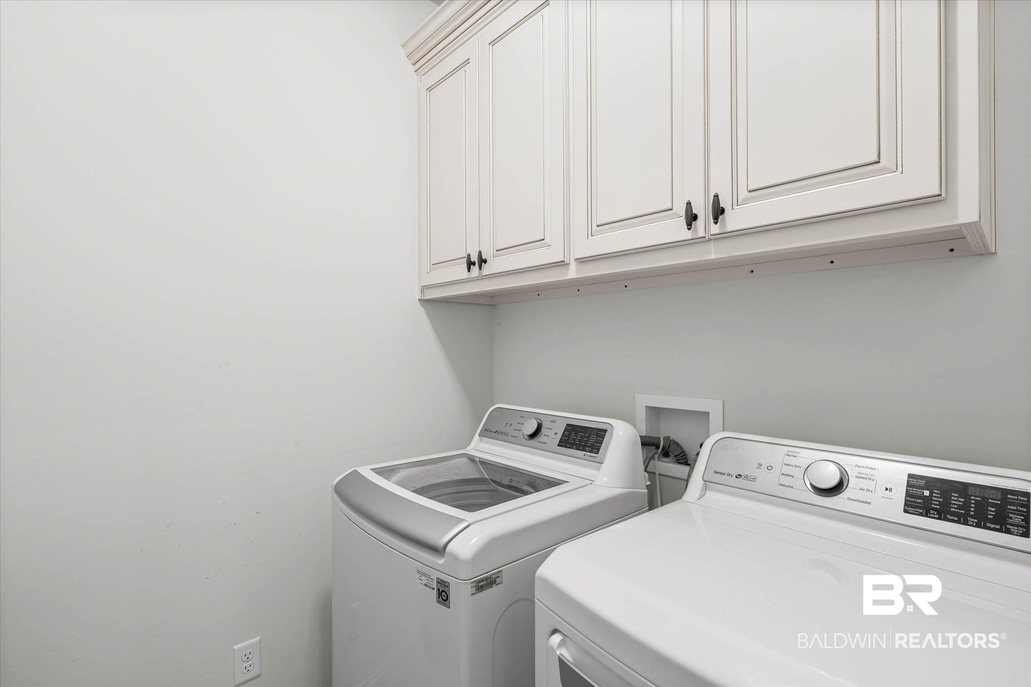 3528 Rue Royal Mobile, AL 36693 - Photo 39 of 53 Laundry room featuring cabinet space and washing machine and clothes dryer