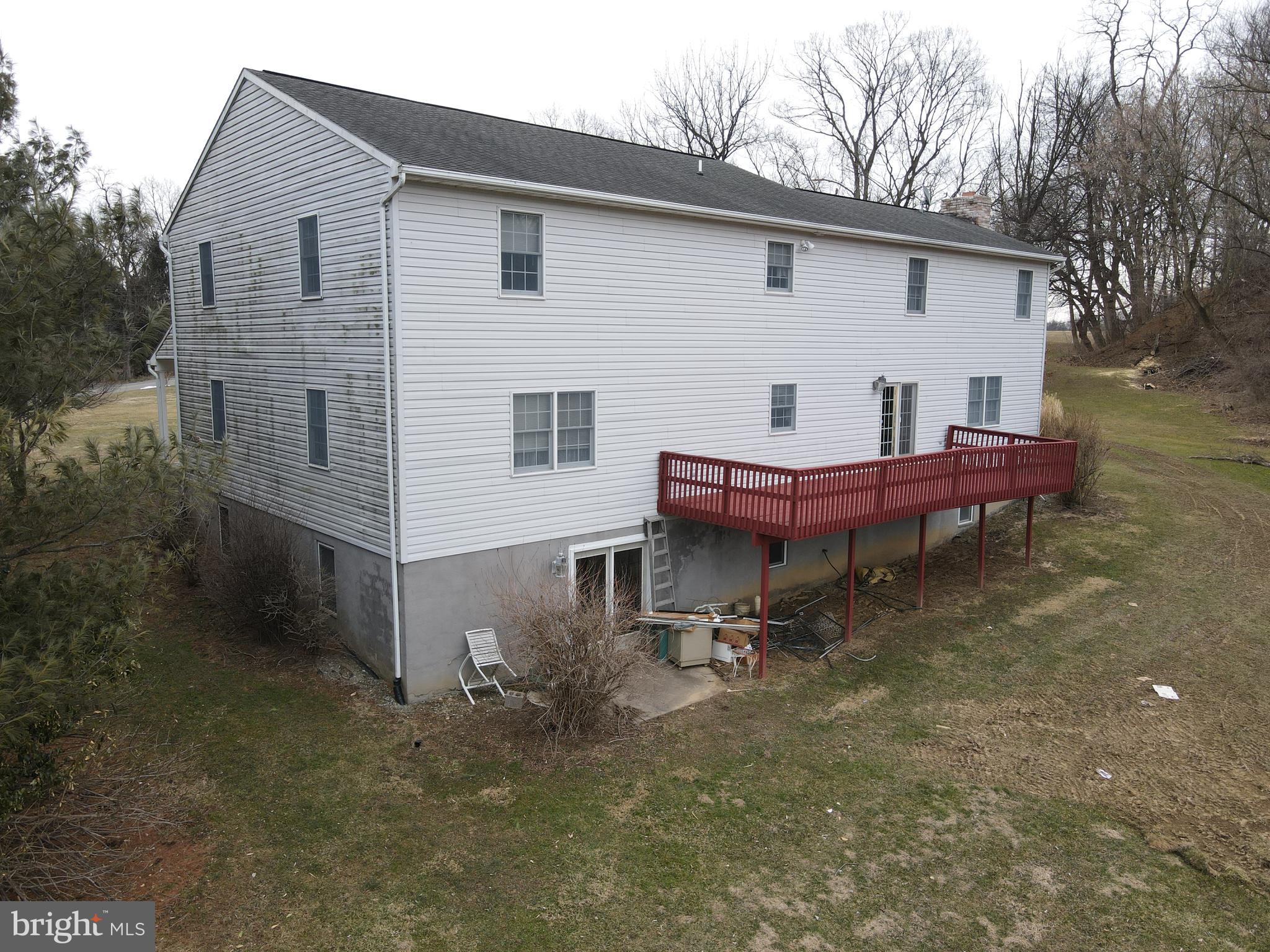 290 Locust Grove Road Bainbridge, PA 17502 - Photo 102 of 108 a backyard of a house with wooden fence table and chairs