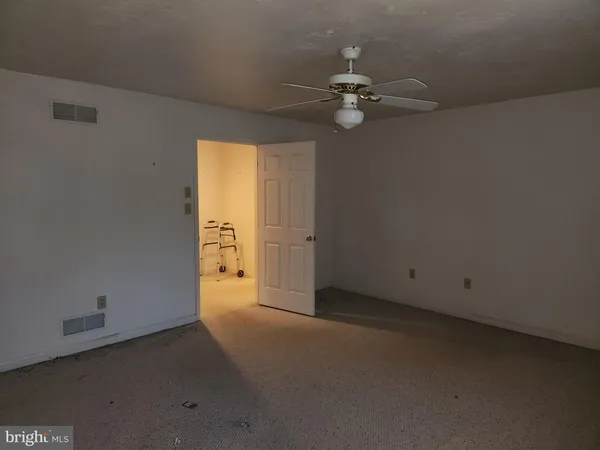 a kitchen with stainless steel appliances granite countertop a stove a sink dishwasher a microwave oven and a refrigerator with wooden cabinets