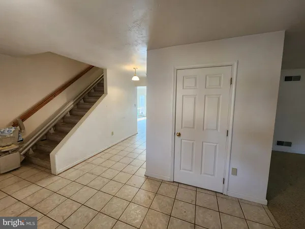 a view of an empty room with a fireplace