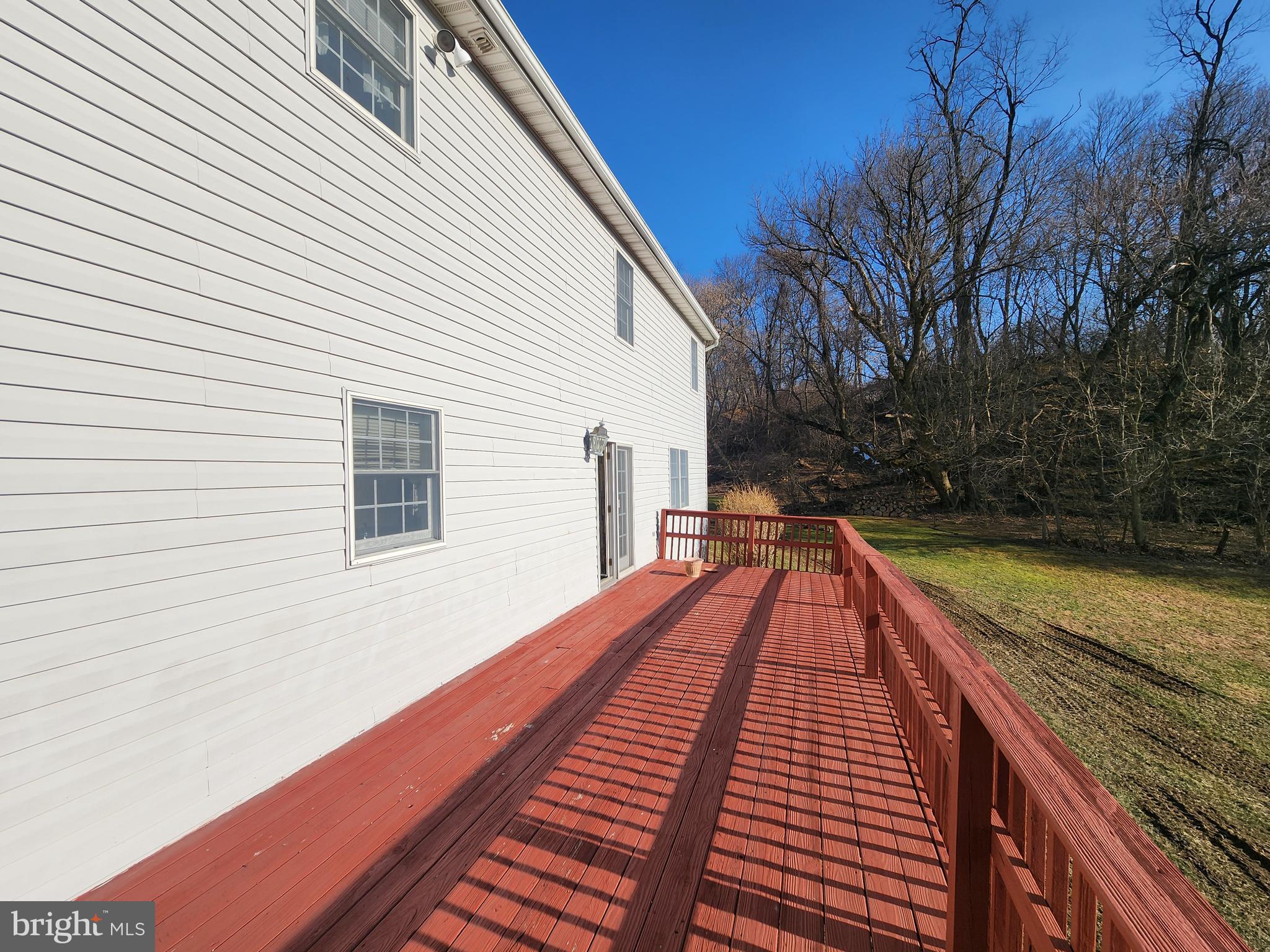 290 Locust Grove Road Bainbridge, PA 17502 - Photo 41 of 108 a view of roof deck with wooden floor and fence next to a yard