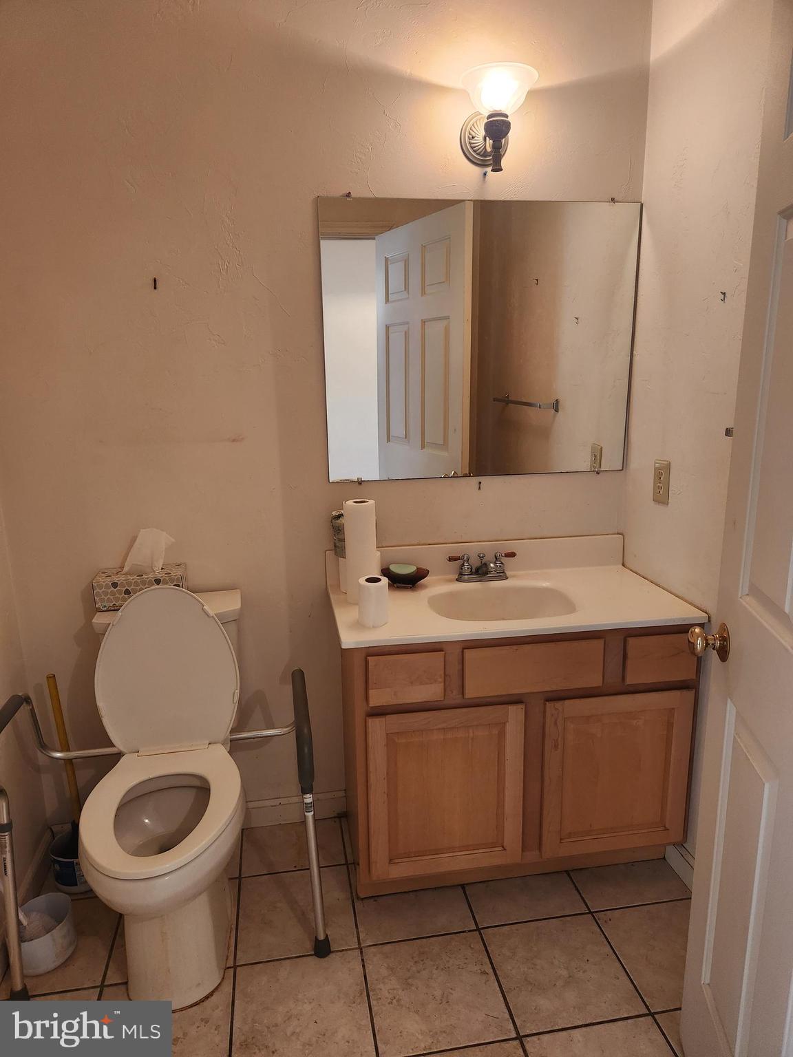 290 Locust Grove Road Bainbridge, PA 17502 - Photo 45 of 108 a bathroom with a toilet a sink and a mirror
