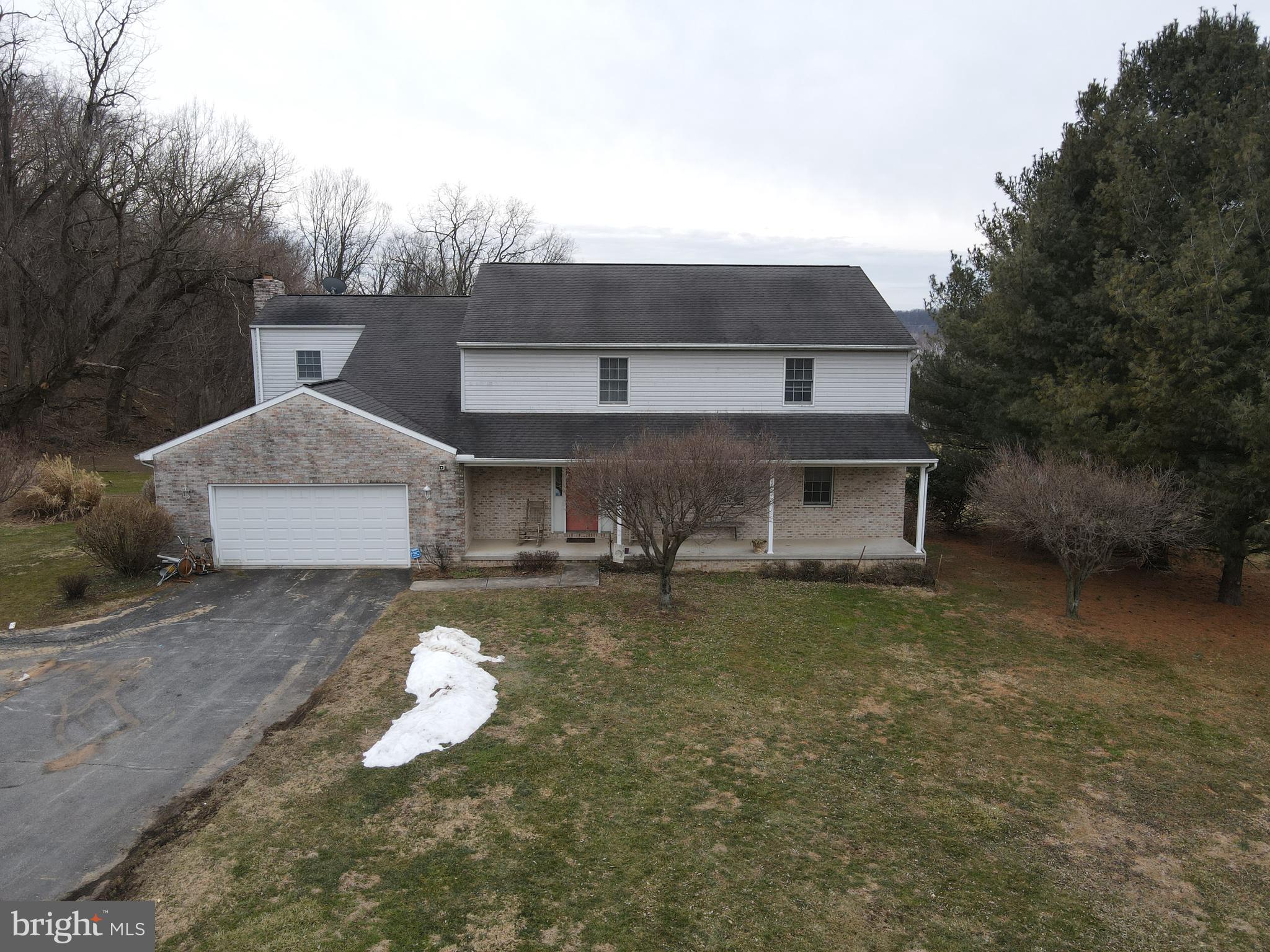 290 Locust Grove Road Bainbridge, PA 17502 - Photo 93 of 108 a front view of a house with a yard and garage