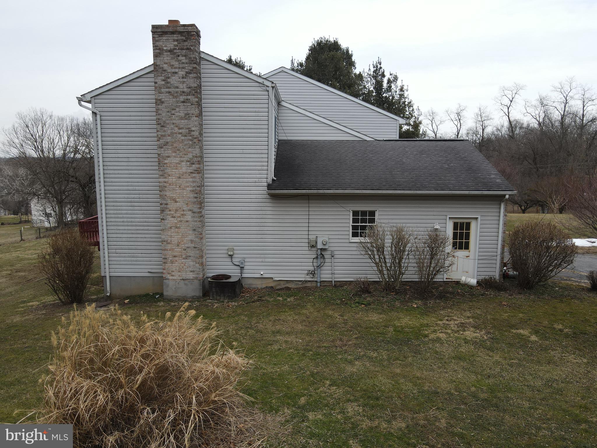 290 Locust Grove Road Bainbridge, PA 17502 - Photo 96 of 108 a front view of a house with a garden