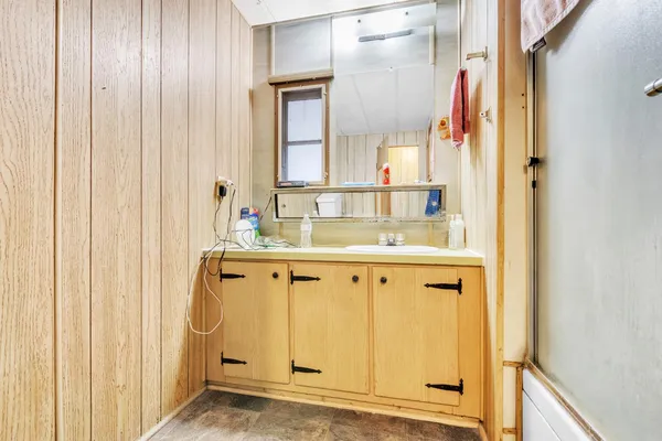 a bathroom with a sink and a mirror