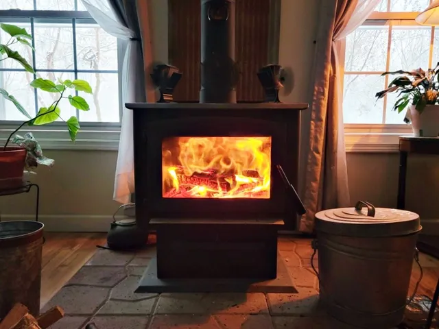 a kitchen with stainless steel appliances granite countertop a sink a stove and cabinets