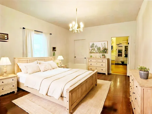 a bedroom with a bed and a couch