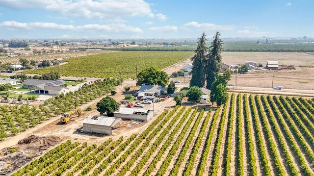 a view of a bench in middle of the road
