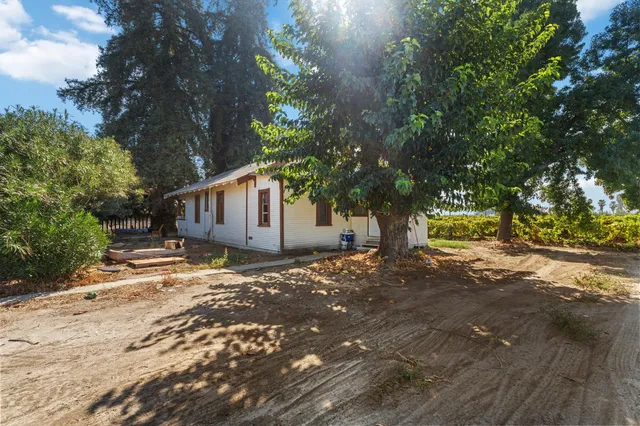 a view of room with hardwood floor and hallway
