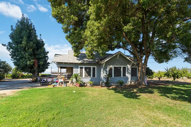a white bath tub sitting next to white walls