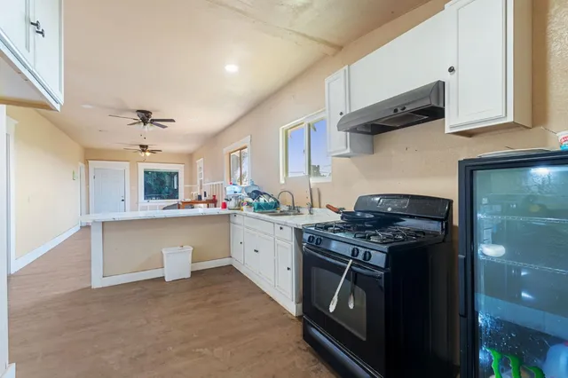 a living room with lots of furniture and a flat screen tv