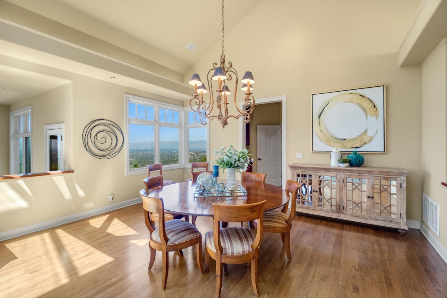 1795 Foster Road Los Gatos, CA 95030 - Photo 22 of 56 a view of a dining room with furniture wooden floor and a chandelier