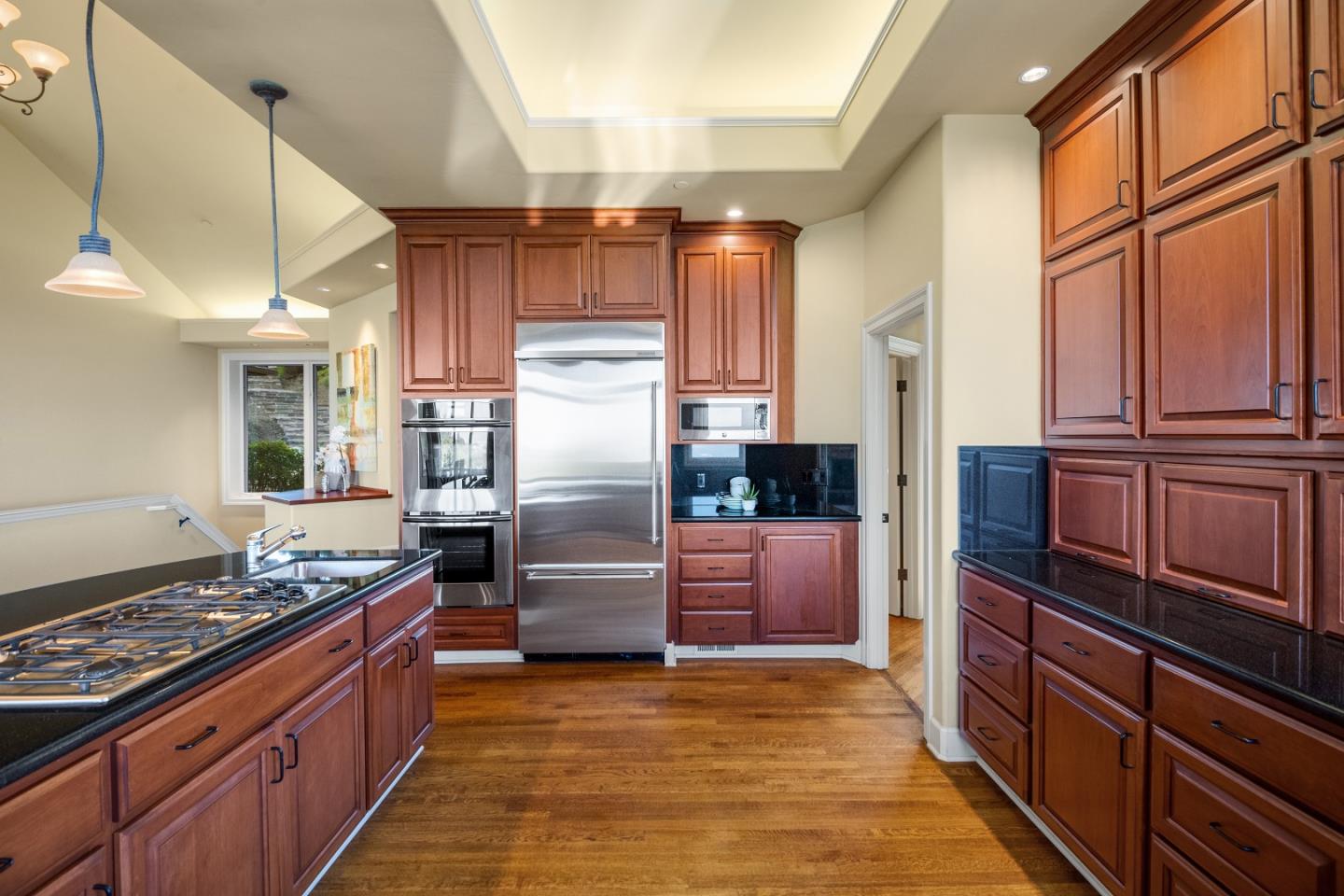 1795 Foster Road Los Gatos, CA 95030 - Photo 35 of 56 a kitchen with stainless steel appliances granite countertop a refrigerator a stove and a sink